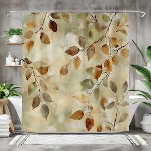 May include: A shower curtain with a watercolor design of brown and green leaves on a beige background.