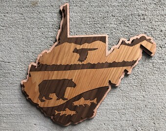 May include: A wooden cutout of the state of West Virginia with a bear, fish, and a bird in the design.