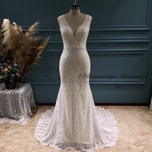 More Dresses @RomantiqueBoho.com nv Lace Bohemian Wedding Dress V Neck Sleeveless Open Back Mermaid Bridal Gowns