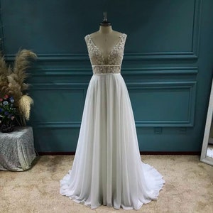 More Dresses @RomantiqueBoho.com Plunging Neckline 3D Flower Lace Open Back Chiffon A Line Wedding Dress Rustic Bridal Gowns