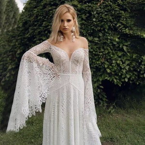 Available @www.ROMANTIQUEBOHO.com Boho Lace Long Batwing Sleeve Rustic Wedding Dress Romantic V Neck Open Back Beach Mermaid Bridal Gowns