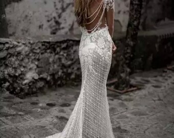 More Dresses @RomantiqueBoho.com Unique Bride Luxury Beading Exquisite Lace Boho Wedding Dress Long Sleeves Open Back Mermaid Bridal Gowns