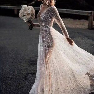More Dresses @RomantiqueBoho.com Glitter Luxury Beaded Sequin Wedding Dress Long Sleeve Open Back Bridal Gowns