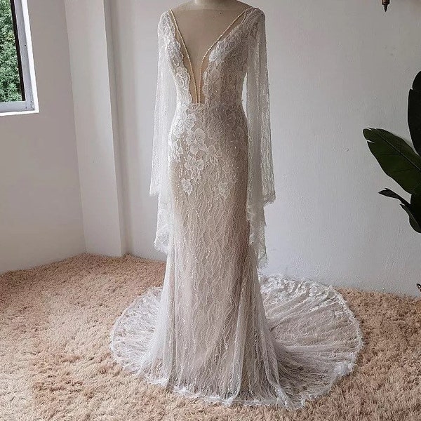 More Dresses @RomantiqueBoho.com Luxury Lace Flare Sleeves Mermaid Wedding Dress Boho Beach Sexy Deep V Open Back Bohemian Bridal Gowns