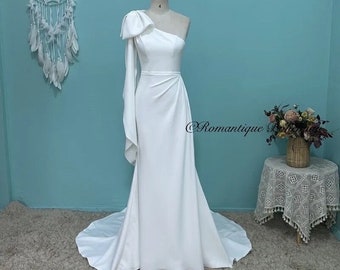 More Dresses @RomantiqueBoho.com Elegant One Shoulder Bow Crepe Wedding Dress Sexy Front Split Mermaid Bridal Gowns Simple Plain