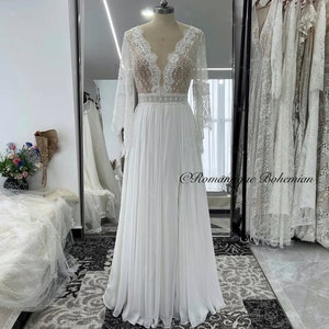 More Dresses @RomantiqueBoho.com Lace Bohemian Wedding Dresses Plunging Neck Trumpet Sleeves Chiffon A Line Side Slit Bridal Gowns