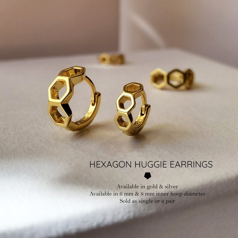 May include: Gold hexagon huggie earrings. Available in 6 mm and 8 mm inner hoop diameter. Sold as a single or a pair.