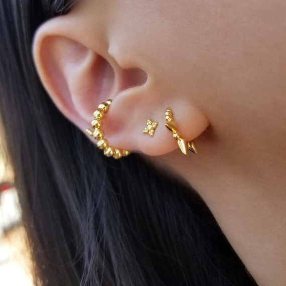 Gold spike hoop best sale earrings