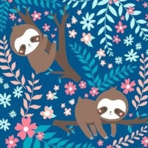 May include: A whimsical pattern featuring two cartoon sloths resting on tree branches. The sloths are brown with white faces and dark brown eyes. The background is a deep blue, adorned with pink, white, and teal floral and leaf designs.