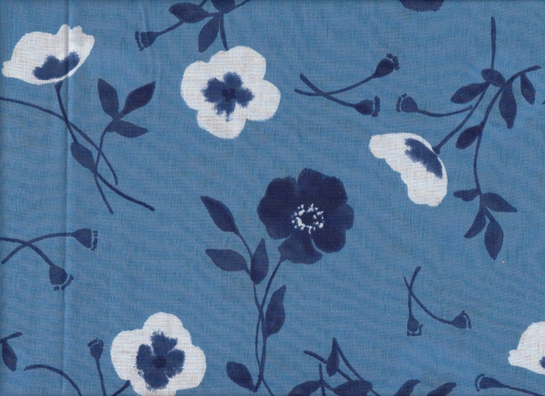 May include: Blue and white floral fabric with a repeating pattern of stylized flowers. The flowers are white with blue centers and are surrounded by blue leaves.