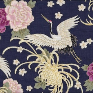 May include: A navy blue fabric with a white crane design, pink and white flowers, and gold accents. The crane is flying with its wings spread wide. The flowers are in bloom and have delicate petals.