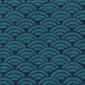 May include: Teal and navy blue fabric featuring a repeating pattern of overlapping arcs. The design creates a textured, wave-like effect, suitable for upholstery or decorative projects.