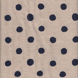 May include: A beige fabric featuring a repeating pattern of navy blue polka dots. The dots are evenly spaced and appear to be hand-painted. The fabric has a slightly textured appearance, suggesting a natural fibre like linen or cotton.