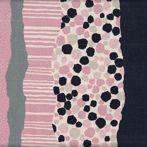 May include: A fabric swatch with a repeating pattern of pink, black, and white geometric shapes. The fabric has a textured, woven look.
