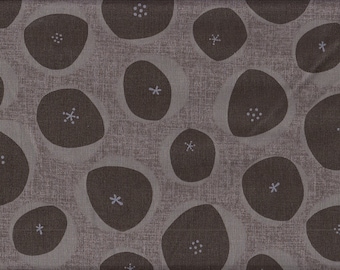 May include: A fabric pattern featuring a repeating design of dark brown, organic shapes with white floral accents on a light brown textured background. The pattern is evenly spaced and creates a consistent visual texture.