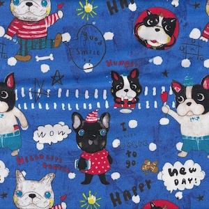 May include: Blue fabric with a repeating pattern of cartoon French bulldogs in various poses. The dogs are black, white, and tan, wearing hats and outfits. Text bubbles say "WOW", "HAPPY", "GOOD SMILE", and "new DAY!"