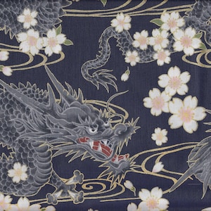 May include: A navy blue fabric with a repeating pattern of black dragons and white cherry blossoms. The dragons are stylized and have a traditional Japanese design. The cherry blossoms are delicate and have a light pink color.