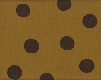 May include: A brown fabric with a repeating pattern of dark brown polka dots.