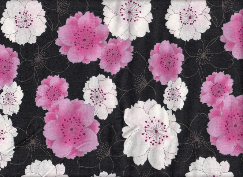 May include: Black fabric with a repeating pattern of pink and white flowers. The flowers have a pink center with a white outline.