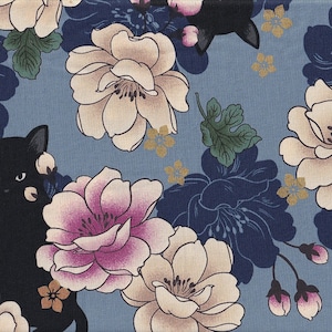 May include: A patterned fabric featuring a repeating design of black cats, large flowers, and foliage. The flowers are in shades of cream, pink, and navy blue, set against a light blue background. Gold accents add detail to the floral pattern.