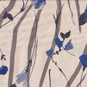 May include: A beige fabric with a repeating pattern of blue flowers and dark gray stems. The flowers are stylized and resemble bell shapes.