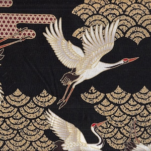 May include: Black fabric with a gold and white pattern of stylized waves and cranes. The cranes are flying in a black sky.