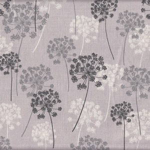May include: A fabric design featuring a repeating pattern of dandelion seed heads in grey and white on a pale purple background. The floral elements vary in size, creating a textured effect. The design is suitable for various textile applications.