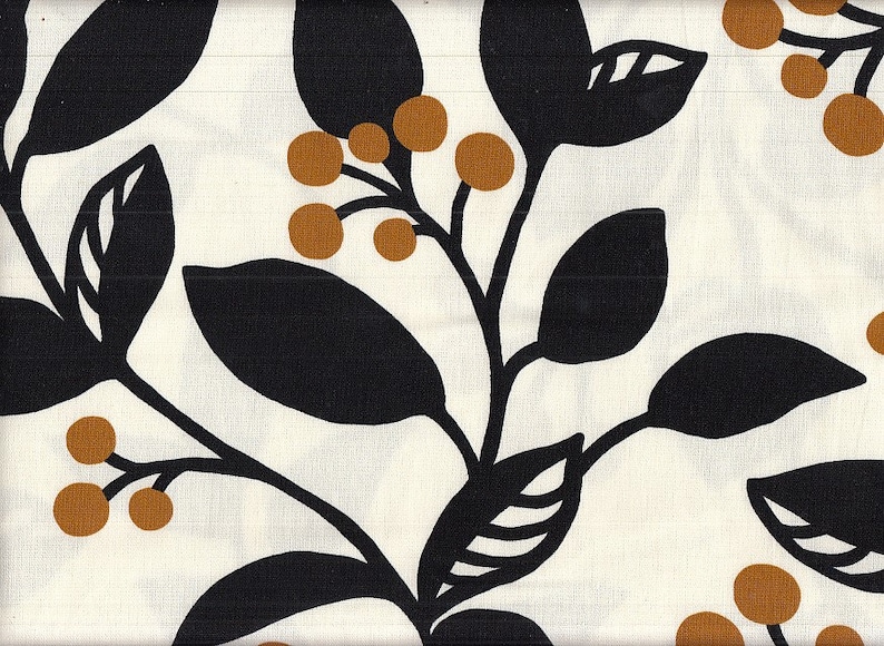 May include: Cream-colored fabric with a repeating pattern of black leaves and brown berries. The leaves are large and stylized, with a simple, bold outline. The berries are small and round, adding a touch of color to the design. This fabric is suitable for various craft projects.