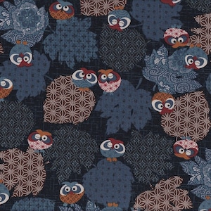 May include: A dark blue fabric with a repeating pattern of owls and stylized leaves. The owls are brown, red, and white with black eyes. The leaves are blue and brown with a geometric pattern.