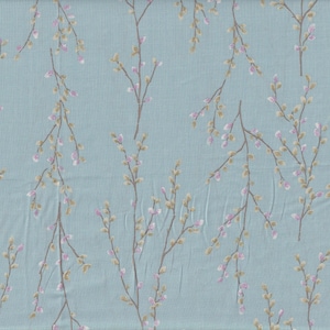 May include: A pale blue fabric featuring a repeating pattern of stylized branches. The branches are brown with small clusters of pink and beige buds, creating a delicate, floral design. The fabric has a subtle texture.