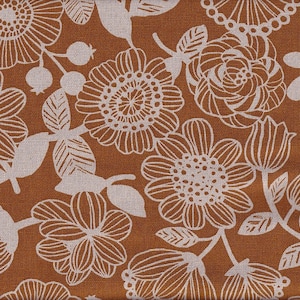 May include: A brown fabric with a white floral pattern. The pattern features large flowers, leaves, and small berries.