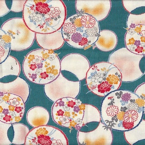 May include: Teal fabric with a repeating pattern of white circles with floral designs in shades of pink, red, yellow, and purple.