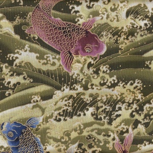 May include: Close-up of a fabric with a Japanese-inspired design. The pattern features koi fish in shades of purple and blue swimming through stylized waves in shades of green and gold. The fabric has a textured appearance.