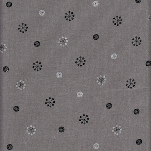 May include: Grey fabric featuring a repeating pattern of black and white starburst and dot motifs. The material has a textured finish, with the starbursts and dots distributed across the surface.
