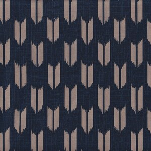 May include: A dark blue fabric with a repeating pattern of brown, vertical, arrow-shaped designs.