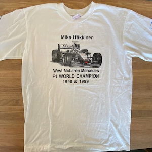 Maglietta campione del mondo Mika Hakkinen 1999 taglia XL (A470)
