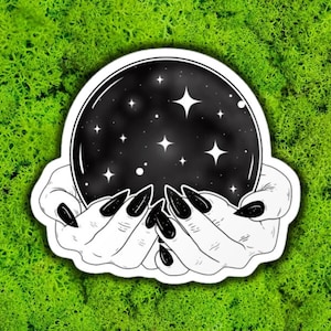 hand holding crystal ball
