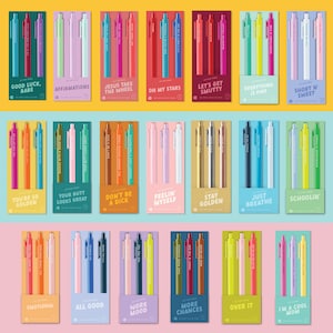 May include: A collection of twenty-one sets of three retractable ballpoint pens, each packaged on a color-coordinated card with unique phrases like Good Luck Babe, Affirmations, Jesus Take The Wheel, Oh My Stars, Let's Get Smutty, and Everything Is Fine.