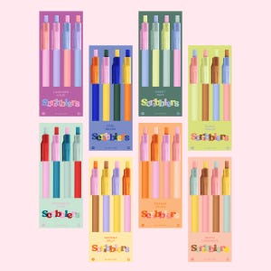 May include: A collection of colorful pen sets, each packaged in a coordinating box. The boxes feature names like "Lavender Haze," "Cool Beans," and "Peach Lemonade." The pens are in various shades of pink, blue, yellow, and orange.