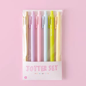 May include: A set of six pastel-colored pens with motivational quotes. The pens are packaged in a clear plastic bag with a white label that reads "Jotter Set Pack of Six".