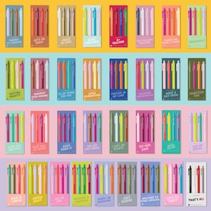 May include: A collection of rectangular card sets, each featuring four retractable pens in various colors. Each card displays a unique phrase such as 'Thanks, It's Vintage', 'Neurospicy', 'Dumpster Fire', 'Per My Last Email', 'Cozy Reader', and 'That's All' in bold text.