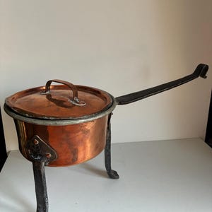 May include: A handmade wooden sign with the text "Welcome to our home" in a handwritten style. The sign is painted white with a distressed finish and a black border. It is designed for indoor or outdoor use.