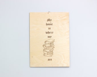 Wood burned sign “My home is where my books are”