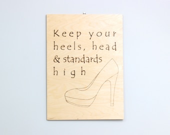 Wood burned sign “Keep your standards high”