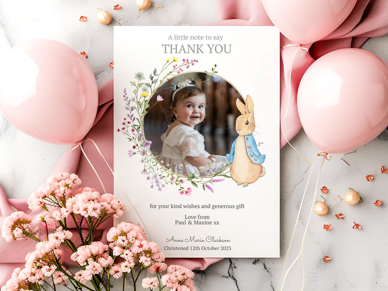 May include: A thank you card with a floral wreath and a photo of a baby girl. The card also features a cartoon rabbit and the text "A little note to say THANK YOU for your kind wishes and generous gift Love from Paul & Maxine xx Anne Marie Clerkson Christened 12th October 2023".
