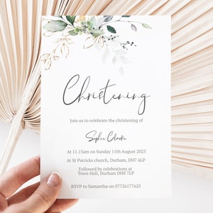 May include: A white card with green and gold floral illustrations. The text on the card reads "Christening" and includes the name "Sophie Clarke" and details for a christening ceremony.