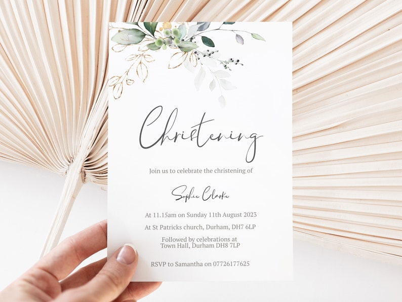May include: A white card with green and gold floral illustrations. The text on the card reads "Christening" and includes the name "Sophie Clarke" and details for a christening ceremony.