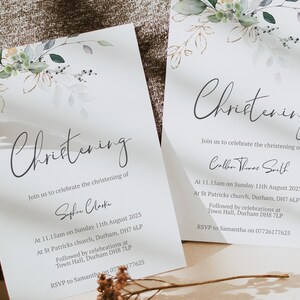 May include: Two white cards with a watercolor floral design in the top corner. The text on the cards reads "Christening" and includes the names of the babies being christened, the date, time, and location of the ceremony, and the contact information for RSVPs.