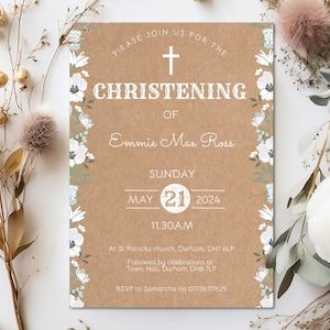 May include: A brown paper card with white floral borders and a white cross. The text reads "Please join us for the Christening of Emmie Mae Ross, Sunday, May 21, 2024, 11:30 AM, At St. Patricks church, Durham, DH7 6LP, Followed by celebrations at Town Hall, Durham DH8 7LP, RSVP to Samantha on 07726177625".