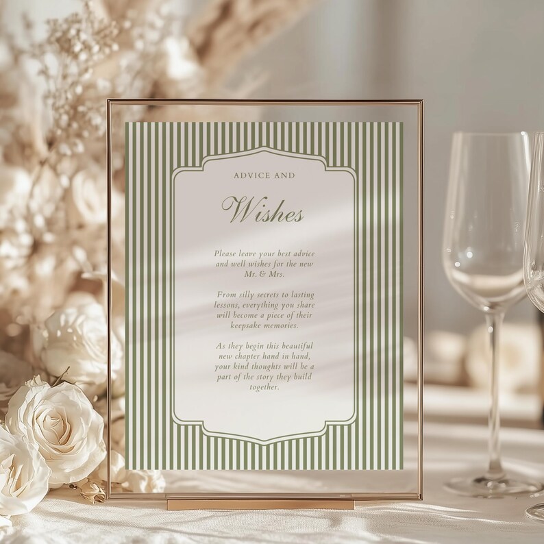 May include: A gold-framed sign with the words "ADVICE AND Wishes" in elegant script. The sign features a green and white striped background and includes text about sharing advice and well wishes for a new couple. Perfect for a wedding or bridal shower.
